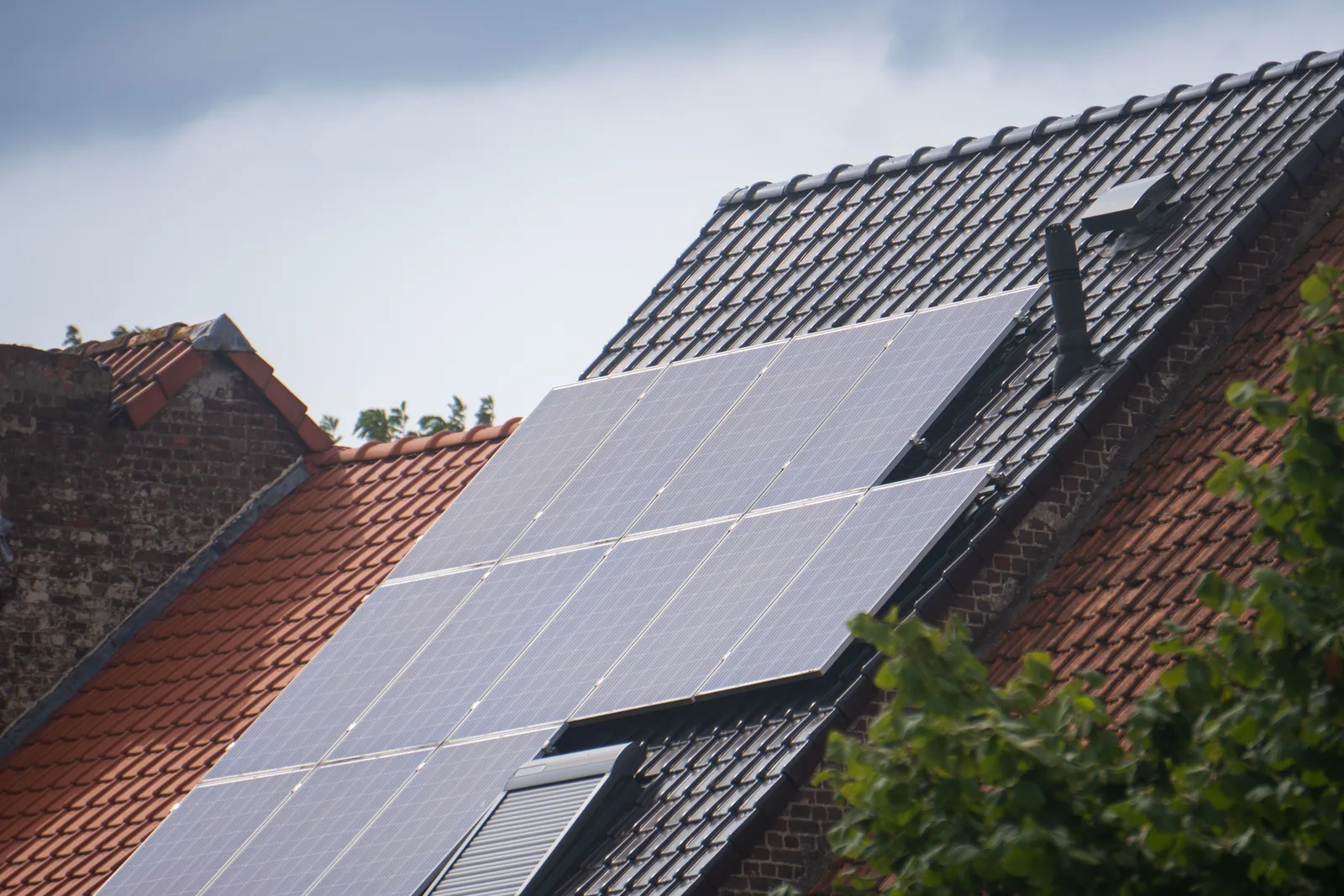 Solar panels installed on a residential rooftop under a clear sky