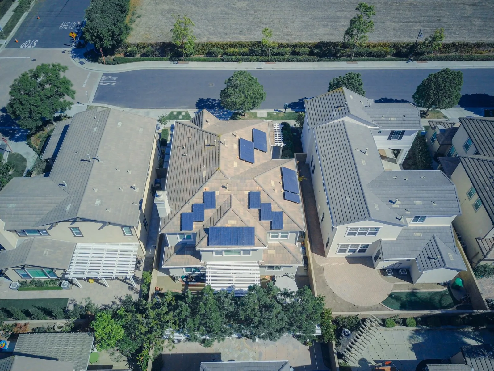 Rooftop solar panels on a suburban house seen from above