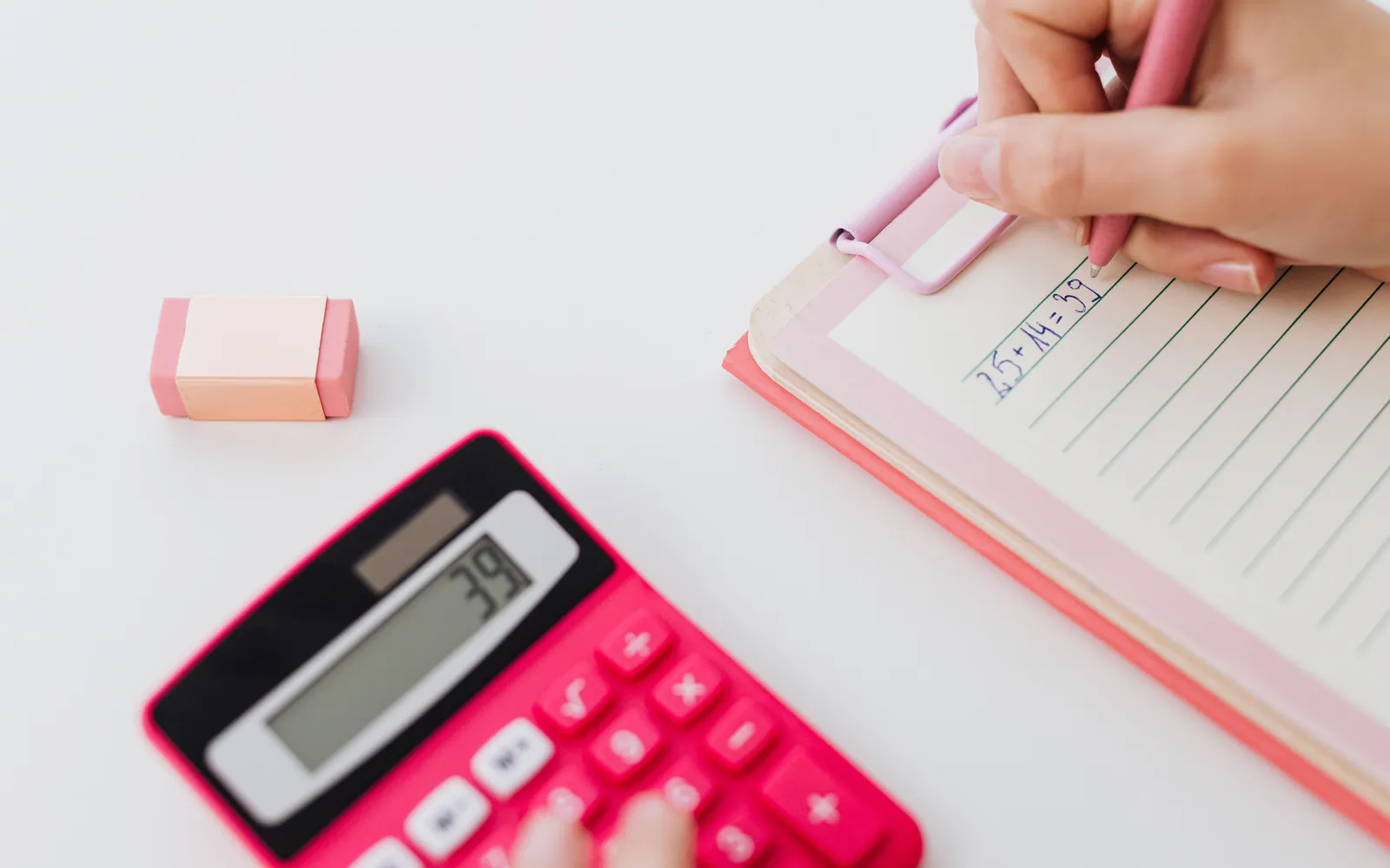 Calculator and notebook on a desk